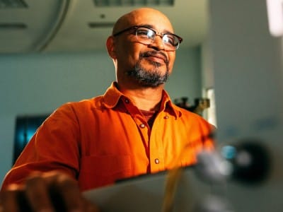 Man in orange shirt 400x300